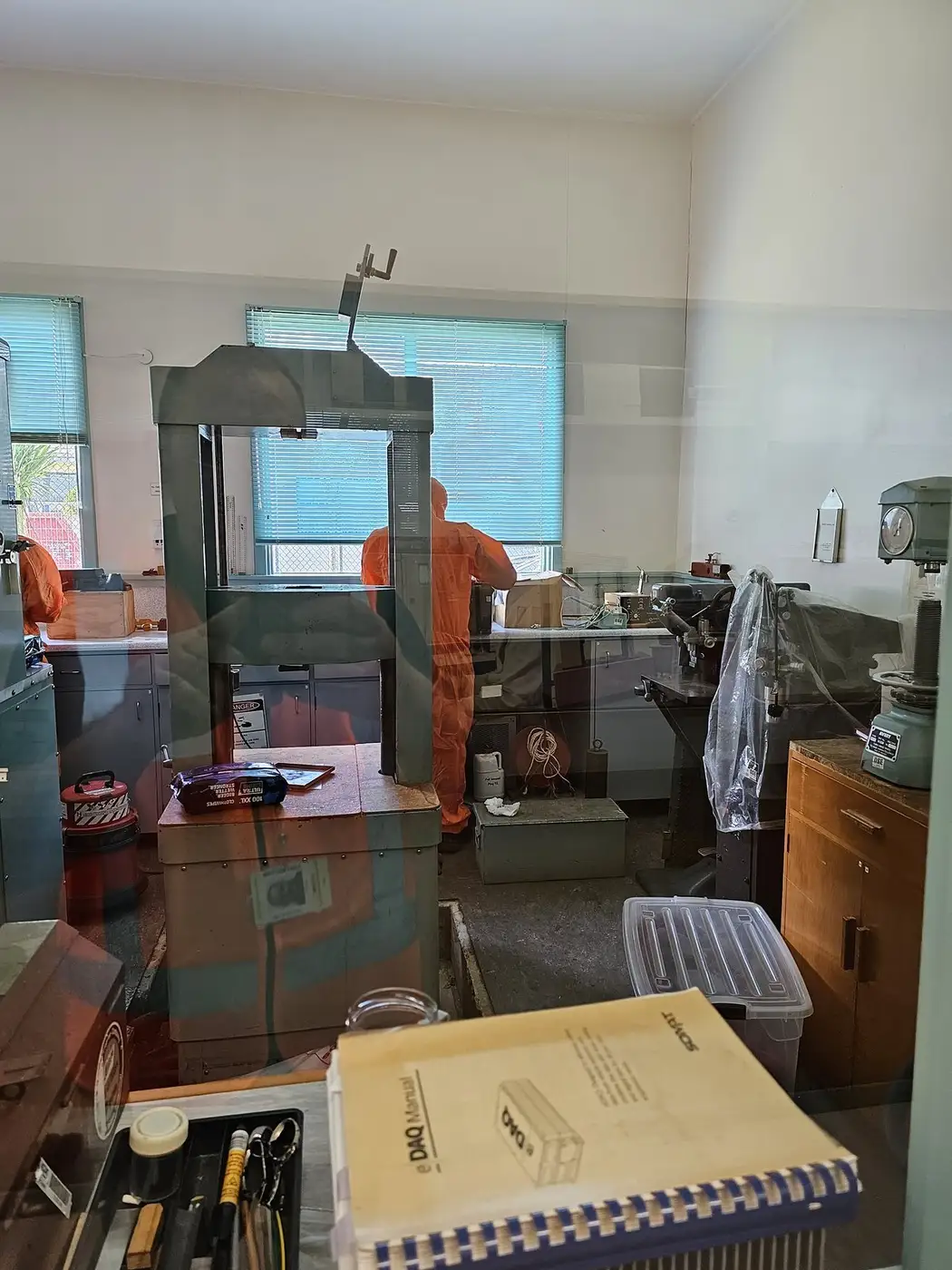 SES operative in orange PPE during office asbestos removal