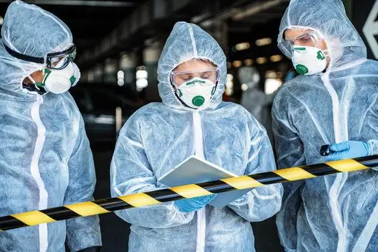 SES specialist cleaning technicians in full PPE