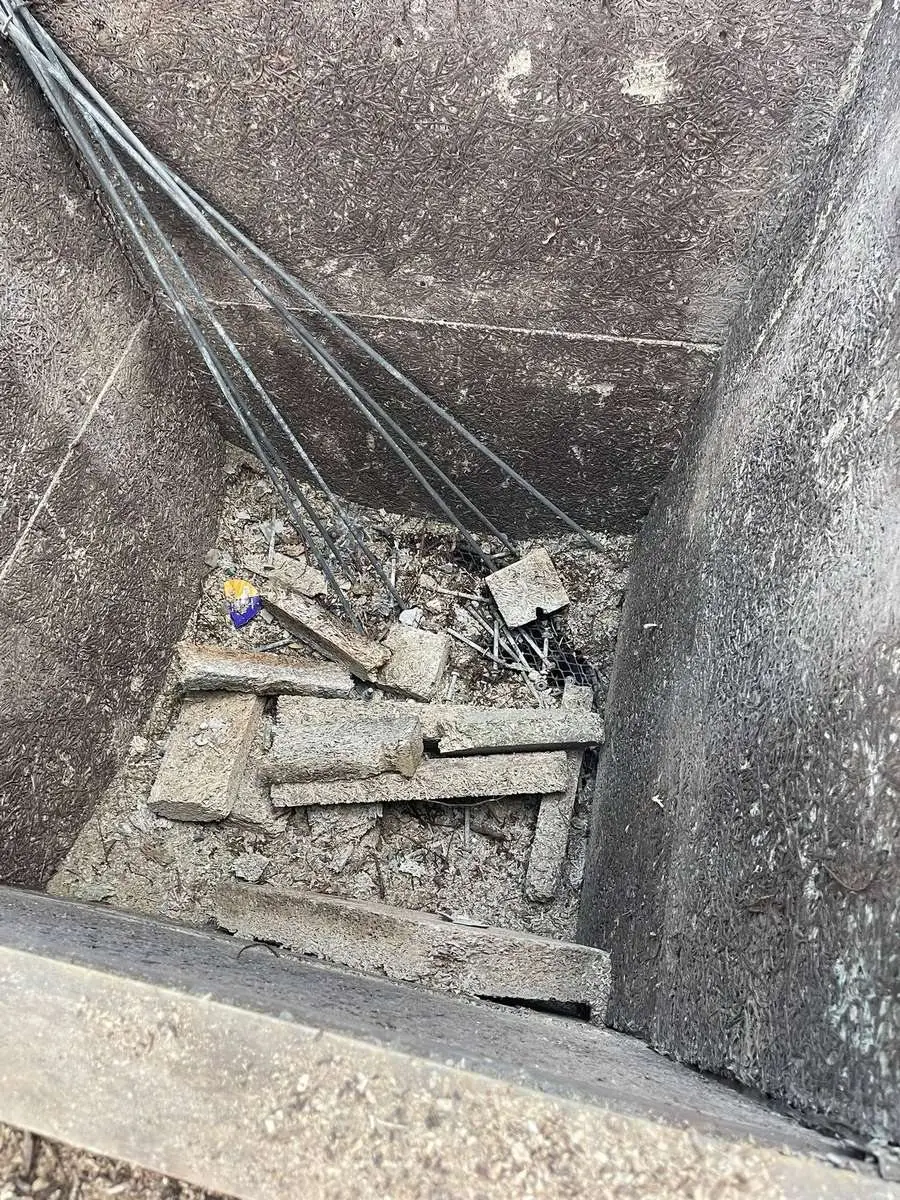 Steel frame base with debris before the final clean and clearance