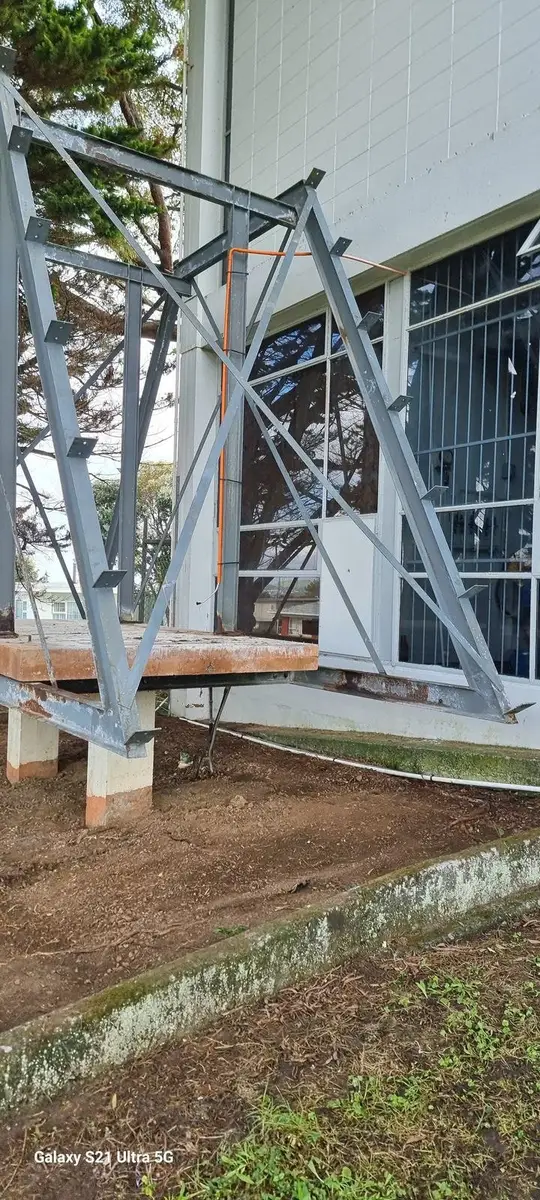 Steel frame base plates after the asbestos-cement structure was removed