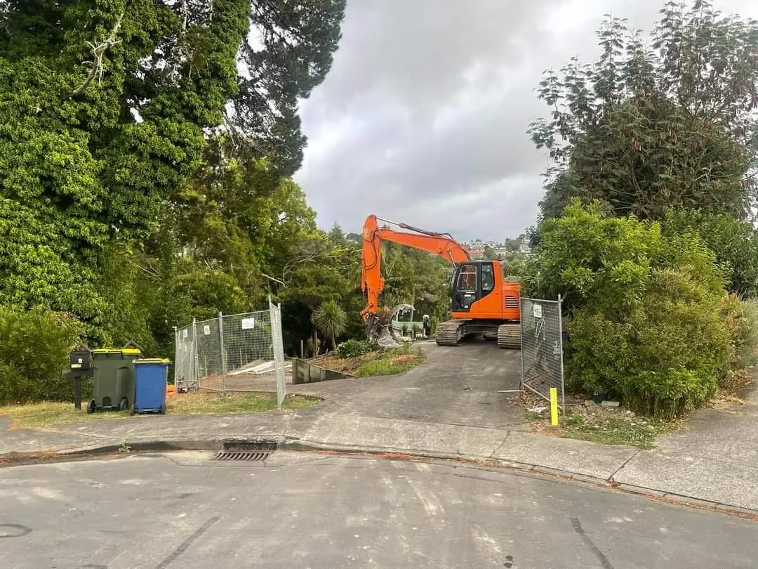Street view of the excavator at the Auckland sub-division demolition
