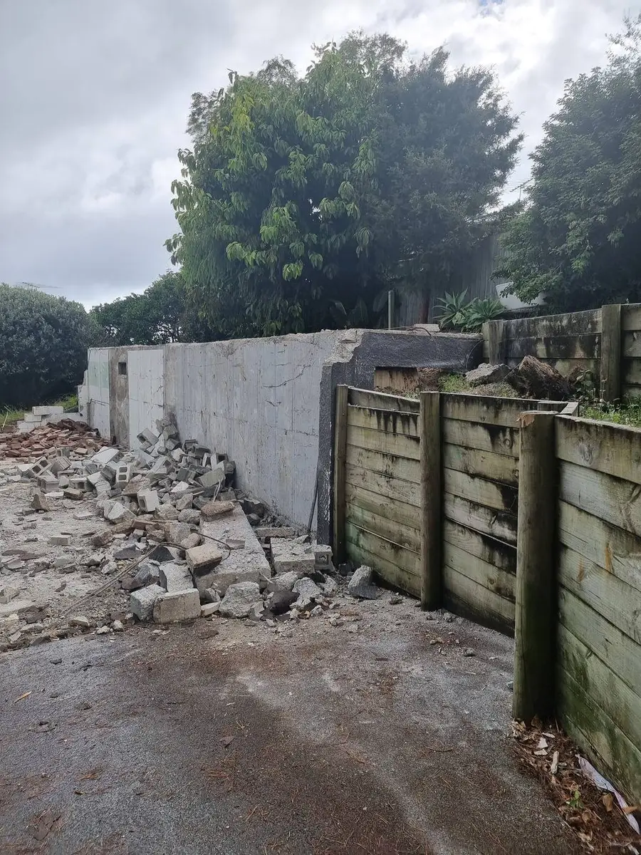 Timber and block retaining walls before demolition