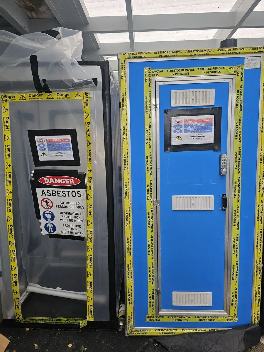 Blue decontamination unit at the warehouse asbestos enclosure