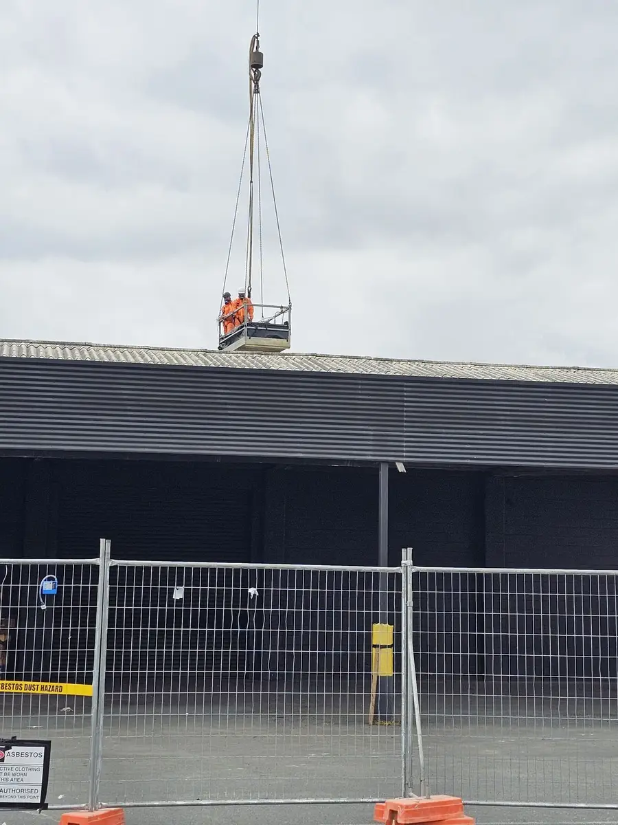 Work platform at the commercial roof during asbestos sheet removal